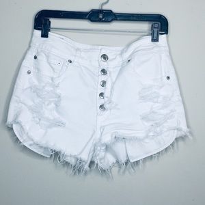Distressed white denim shorts
